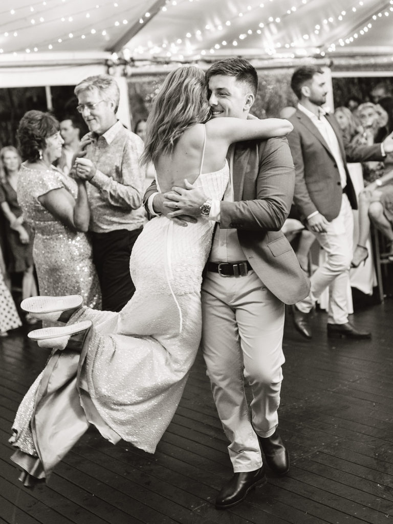 Bride and groom on the dancefloor swinging around