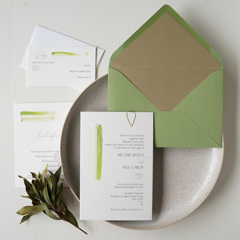 Hand-painted wedding invitations with green painting and green and gold envelope