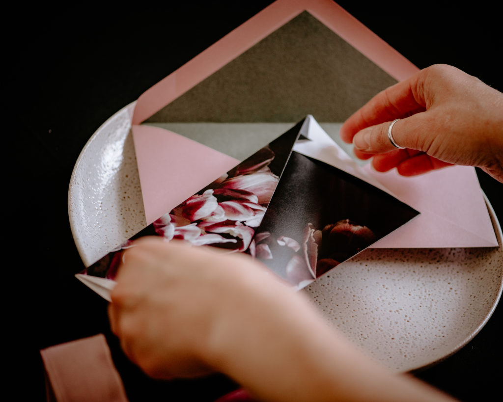 Origami wedding invitations with black and pink floral design