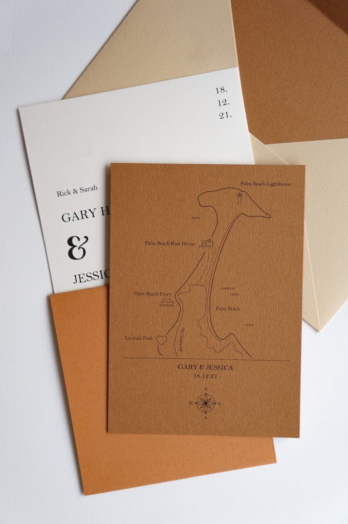 A brown, cream, and terracotta wedding invitation with custom map.