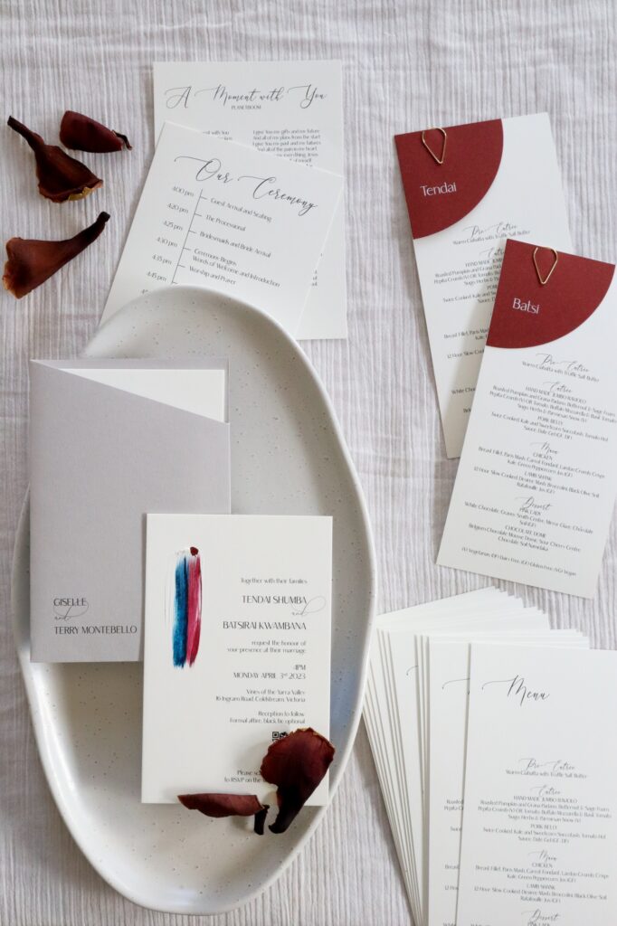 Ivory, burgundy, and navy painted wedding invitations by A Tactile Perception.