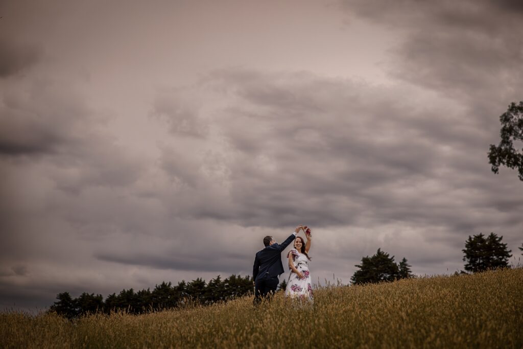 Sunset wedding photos with clouds overhead.