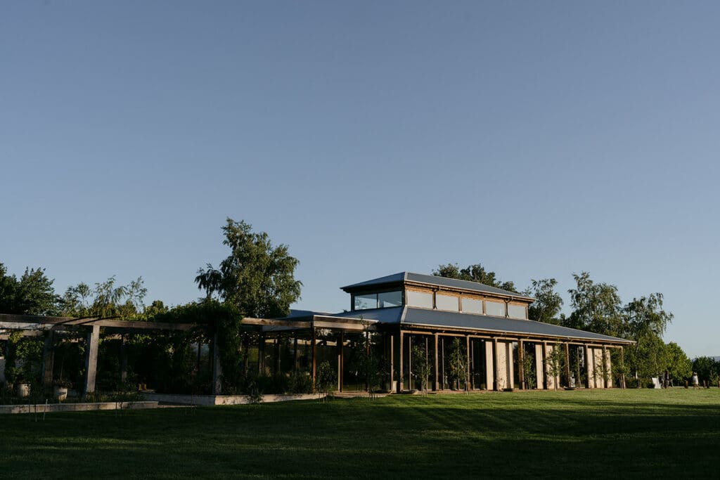 The Barn at Stones of the Yarra Valley, in front of a clear blue sky